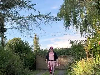 Dressed in a pink ruffled dress for an evening