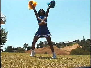 Voluptuous black cheerleader rides and sucks big black cock