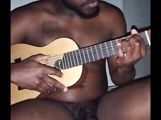 Translating other meanings of horns in the air while singing and playing guitar naked