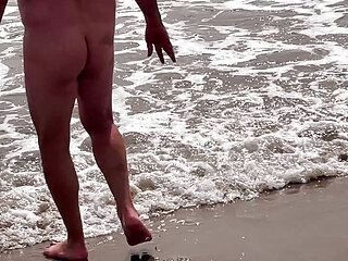 I expose my sissy on the beach with her flat chastity cage