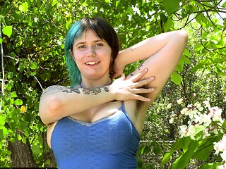 Blue Tipped Hair Girl Shows Tattoos and Armpits