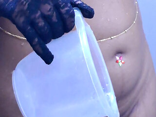 Young girl stripping and taking bath