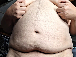 Chubby guy stands and cums