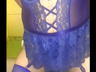 Crossdresser in blue lingerie fucks her ass with a dildo