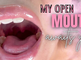 Thirsty girlfriend's open mouth awaits tongue play