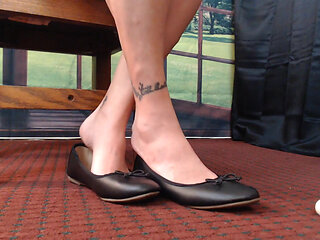 Close up ballet flats dangle play natural
