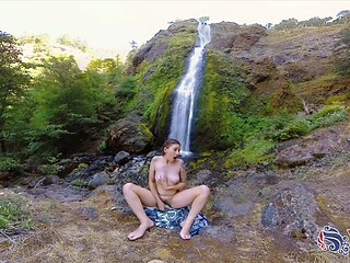 Solo hiker toys her pierced nipple and wets her pussy with a dildo