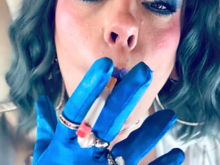 Dressed In Silver & Gloves & Rings Tina Snua Smoke A Supeking Cigarette