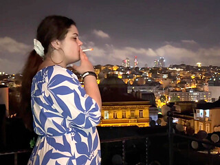 Smoking on the Balcony with a City View
