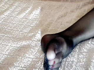 Teen schoolgirl shows off her sexy legs and feet in nylon stockings