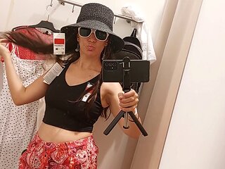 Sexy brunette in the fitting room shows off her woolly pussy and big nipples