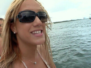 Horny lesbians touching each other on the boat