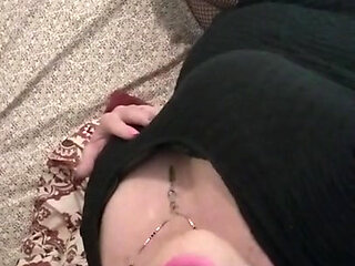 Sexy crossdresser Krissy Sweets in lingerie and high heels with fishnet stockings