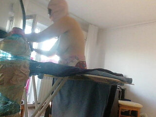 Amateur wife doing housework naked. Sexy and naughty wife trying on clothes that she cuts.