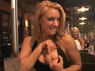 Anne is a blonde beauty who reveals her big boobs in public.
