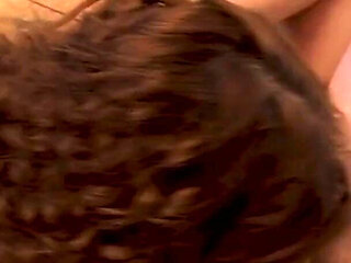 Curly-haired milf swallows cock deep into her throat