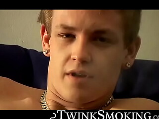 Bad stud Tomy chainsmoke his red cig while jerking on the couch