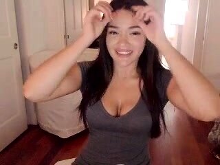 Busty babe playing with her big boobs