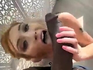 Hot redhead riding two big cocks