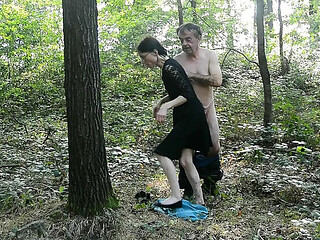 Baechel gives blowjob and handjob during a walk in the forest