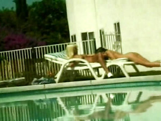 Attractive MILFS licking each other's cunts by the pool