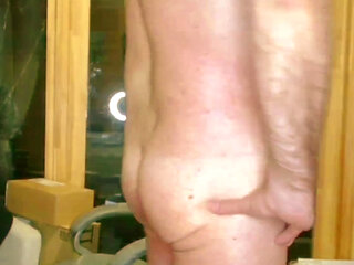 Spanking, wanking and a huge cumshot wearing a cockring and butt plug