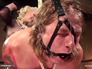 Man in invered suspension ass caned