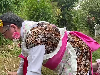 In gardener's outfit with a little leopard dress to pee on all fours