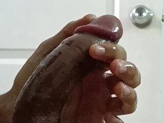 hot boy using oil to stroke his full length cock and ball big and cum hard