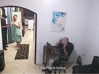 While the Husband Works, the Wife in a Towel Greets the Delivery Man