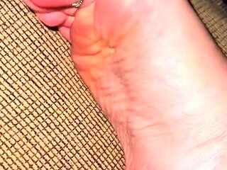 Cute teen girl enjoys foot fetish