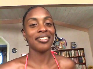 Horny ebony sits on a big white dick and fucks it hard with her pussy
