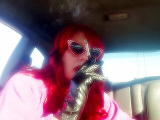 Mature Redhead Wearing LeatherGloves -Holder Smoking VS120 in Car
