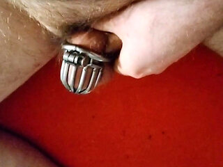Redhead faggot jerks off desperately in chastity cage