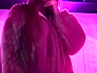 Smoking a Cigarette Outdoor While Wearing Only a Bikini and a Jacket