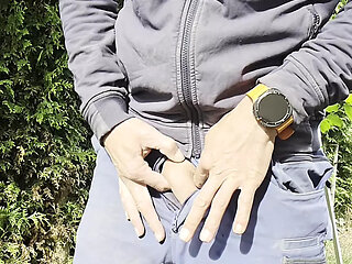 Young craftsman in Engelbert Strauss workwear pisses with his hard thick cock