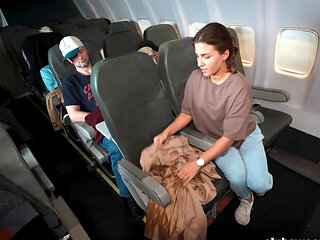 While the others are napping she orgasms on the plane