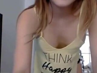 Superb looking teenager is posing and taunting in front of the camera in underpants and flog top