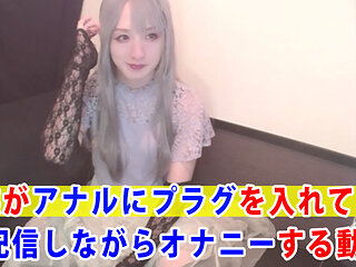 A video of a cross-dresser masturbating while inserting a plug in her anus