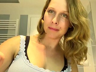 Ugly mom fondles her boobs while putting her make up on