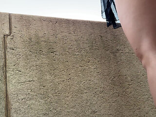 Sexy Hot Tight Shaved Pussy Petite Brunette Takes Her Panties off on the Balcony to Show What Is Under Her Short Skirt