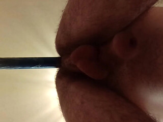 Hairy gay slut riding a dildo.