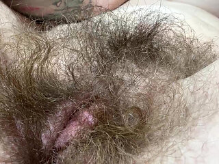 Hairy girl rubbing out her big clit