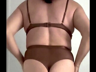 Amateur crossdresser trying on just delivered bodysuit