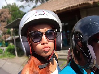 Thai beauty with natural tits and glasses indulges in a steamy al fresco BJ session