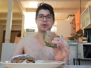 Pig guy eats a sandwich while jerking big cock