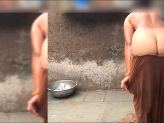 The elder sister-in-law is watching the brother-in-law in the open bathroom after going home naked after walking in the open for