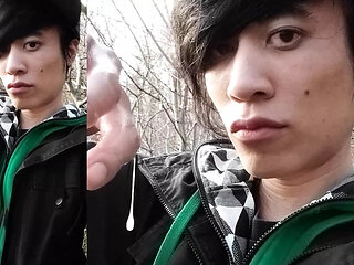 Outdoors, Jon Arteen masturbates his tumescent twink cock, ejaculates cum that sticks to his fingers and slowly drips.