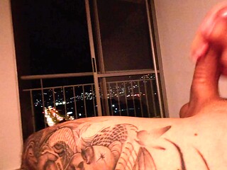 Huge cock and Latin babe in POV jerk-off session with a city view