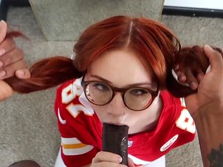 Cute nerdy redhead sucks a giant black cock and swallows it all the way to the base
